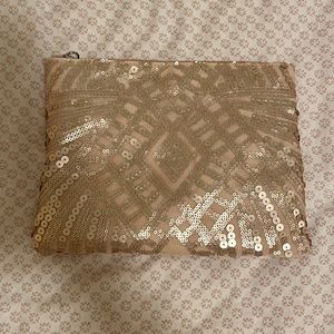 - Pink sequin clutch/pouch.